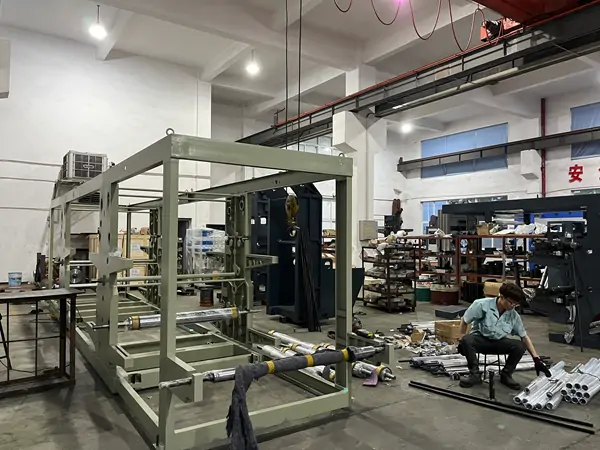 flexographic printing press frame under assembly manufacturing workshop